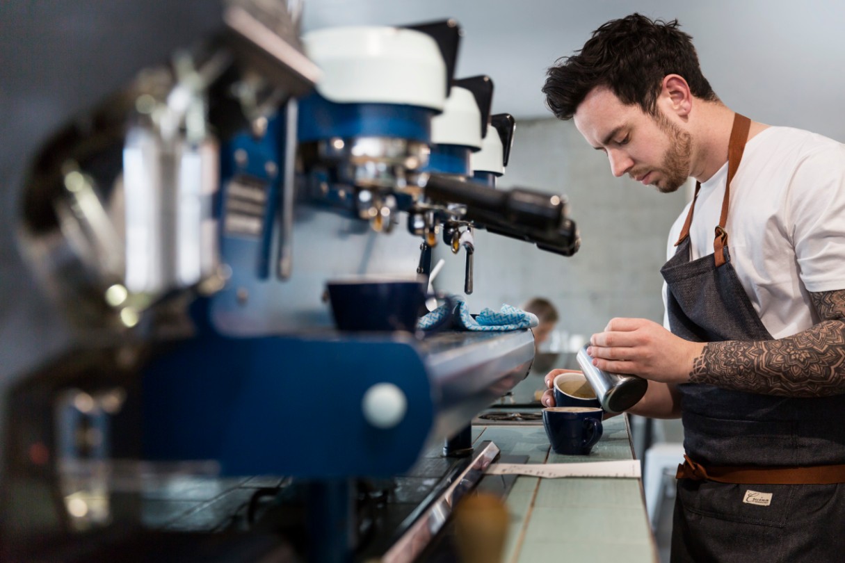 Business owner making coffee